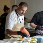 Chef Lior Hillel of Bacari prepping a dish for the main course at Generous Plates benefiting Union Station Homeless Services